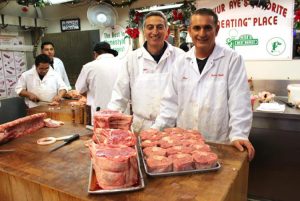 Michael Rella with Uncle Peter Servedio at their butcher shop, Peter's Meat Market, in the Arthur Avenue Market in the Bronx